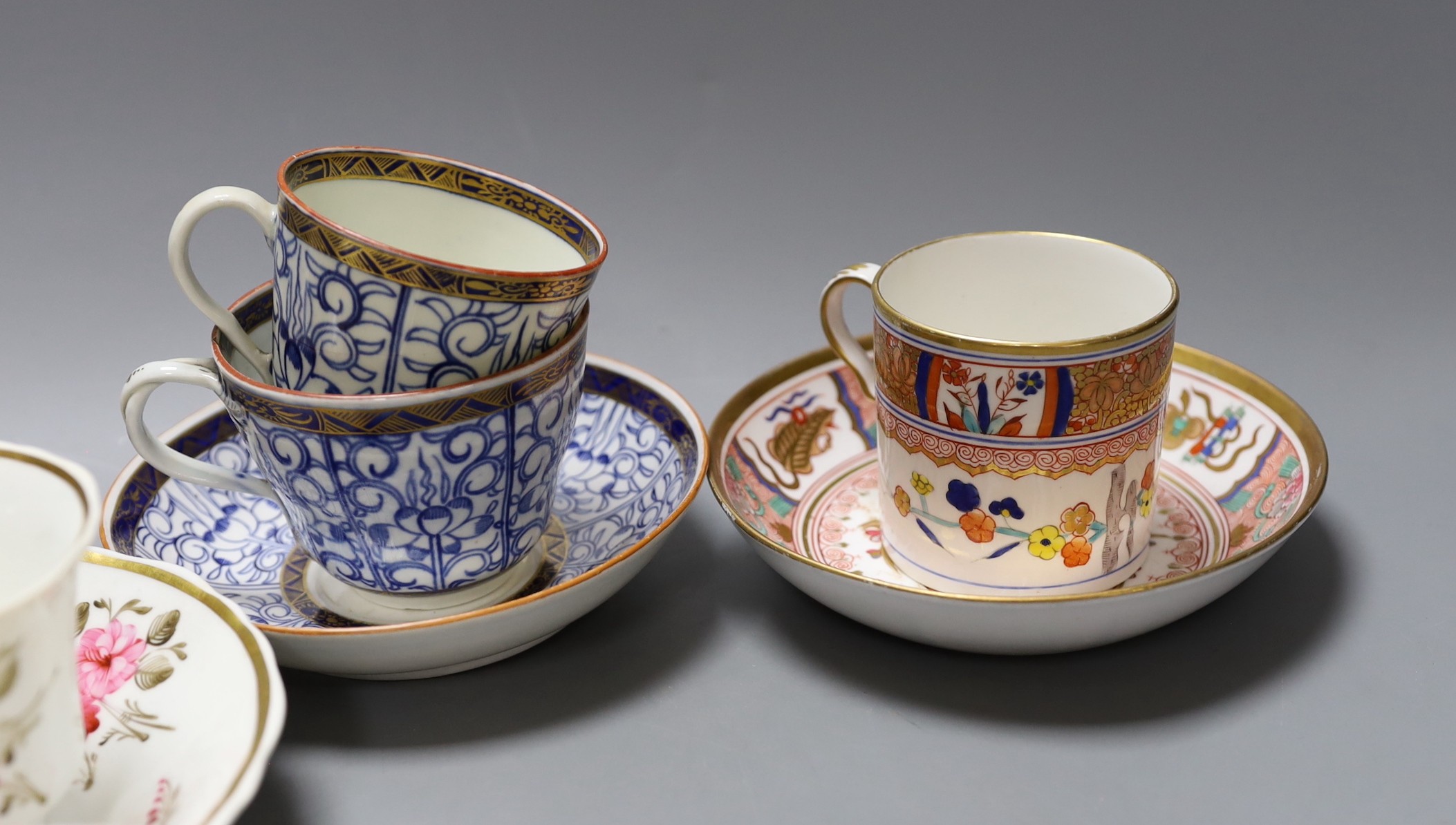 A Spode Imari pattern coffee can and saucer, a Coalport Imari cup and saucer, a Coalport style floral trio, a Worcester Royal Lily trio, a Flight teabowl and saucer and an English rose painted cup and saucer